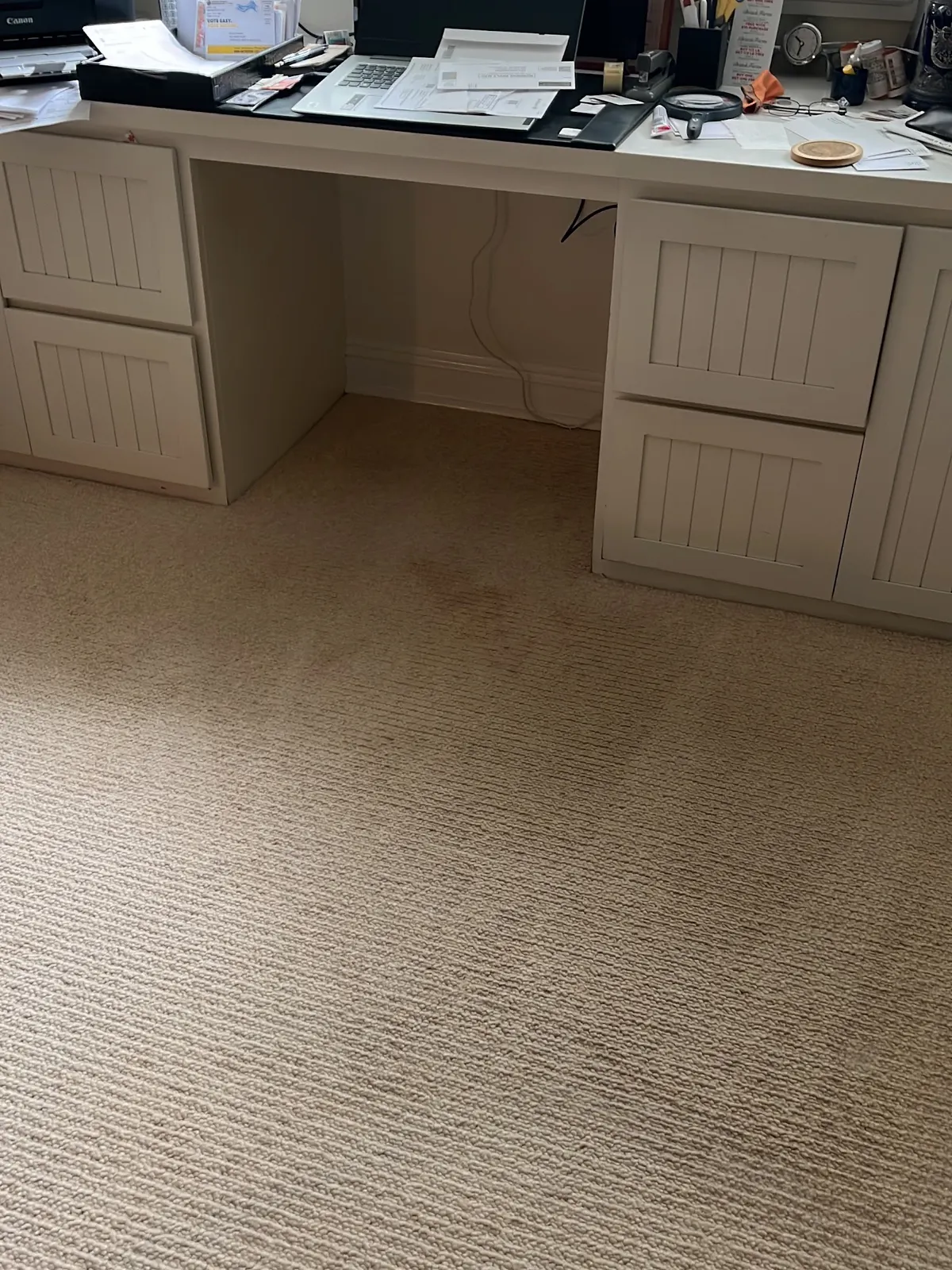 Red spill on a home office carpet beside the cleaned carpet after cleaning