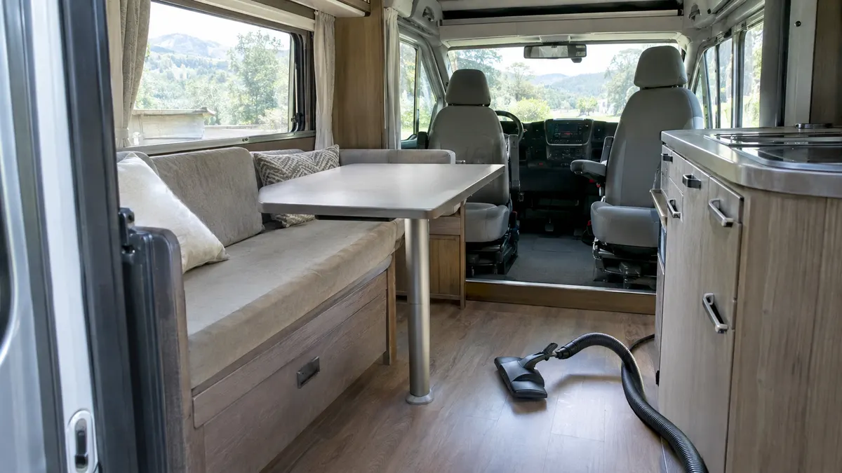Cleaned fabric car seats and floor mats in a vehicle cabin