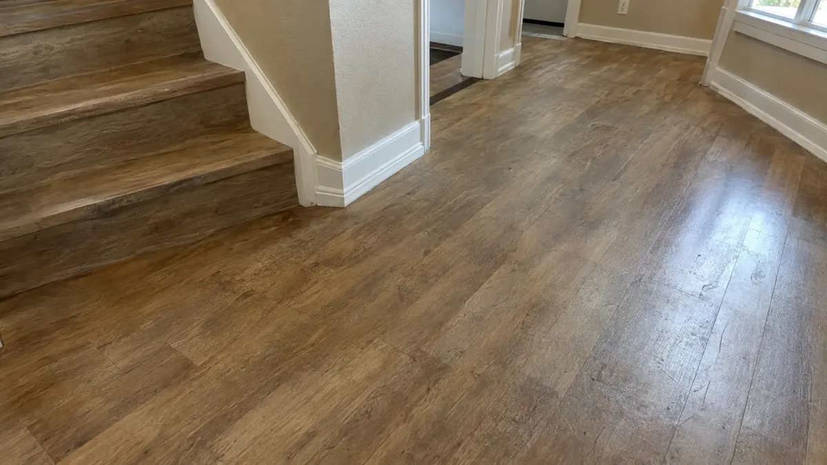 Clean luxury vinyl plank floor with the wear layer intact