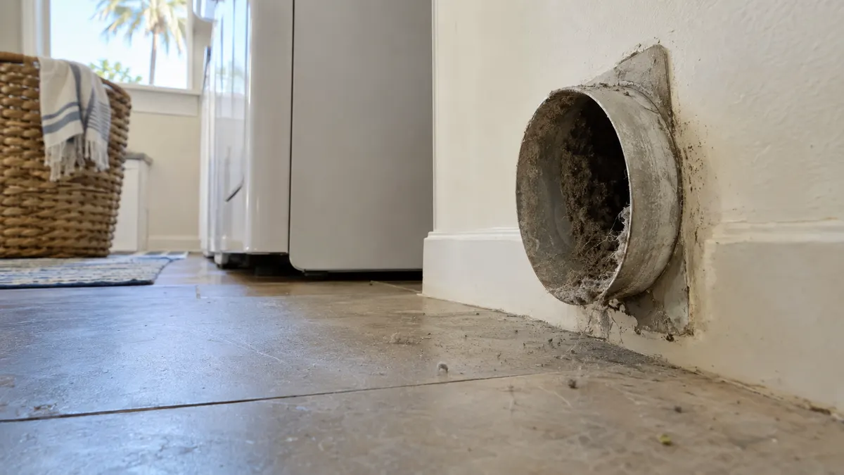 Packed lint removed from inside a dryer exhaust line