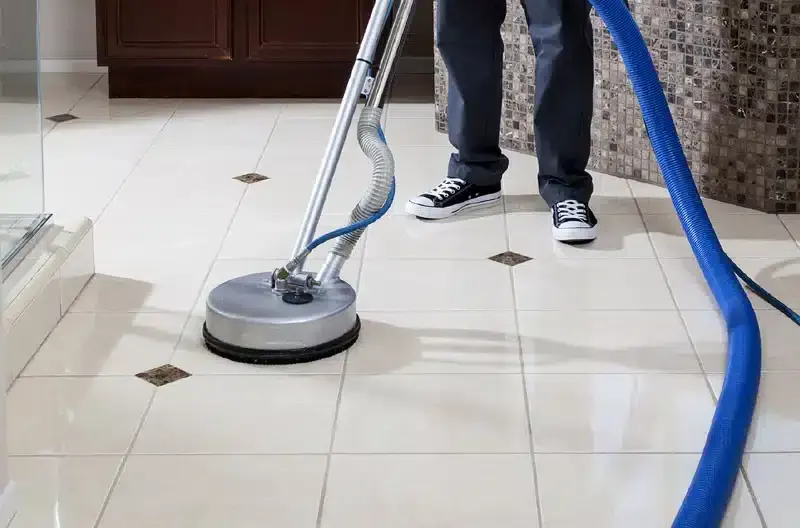 Professional cleaning of tiled floors with specialized equipment.