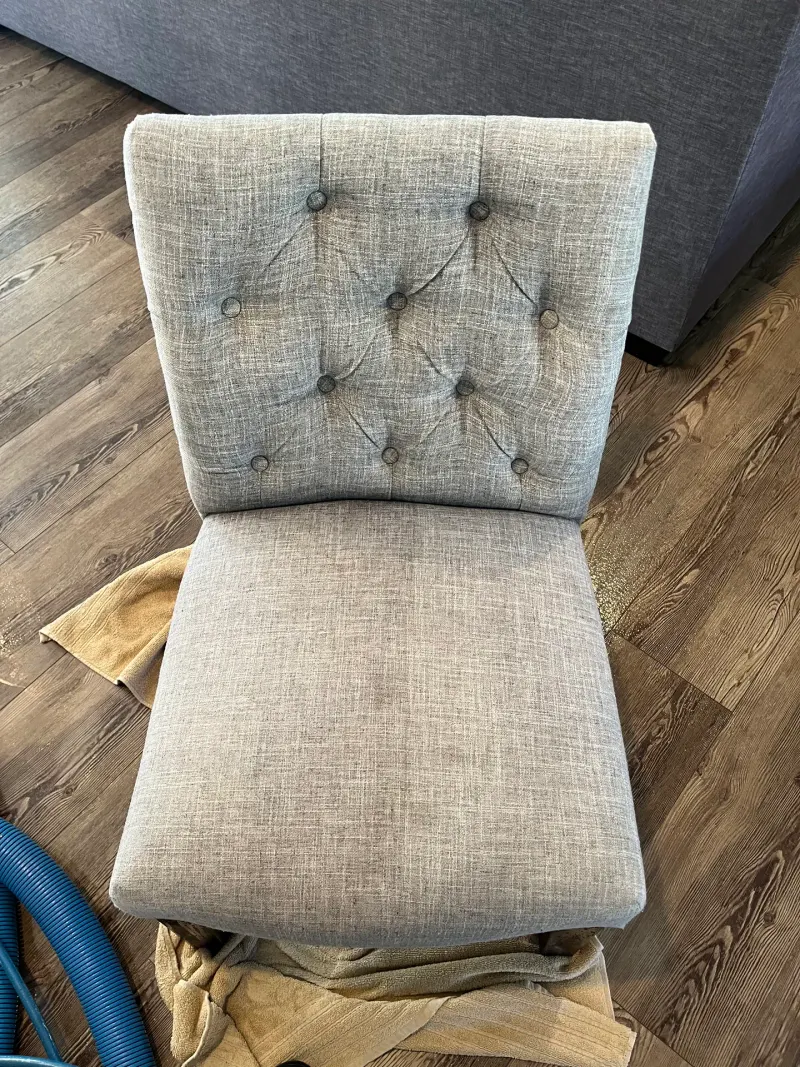 Tufted chair during upholstery cleaning