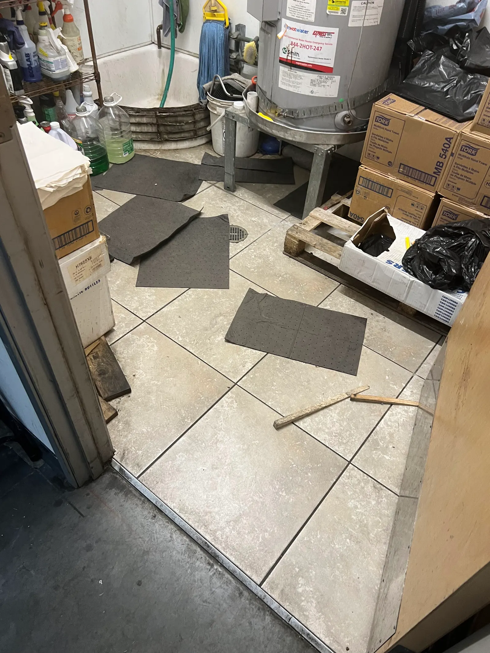 Absorbent pads laid on a wet tile floor