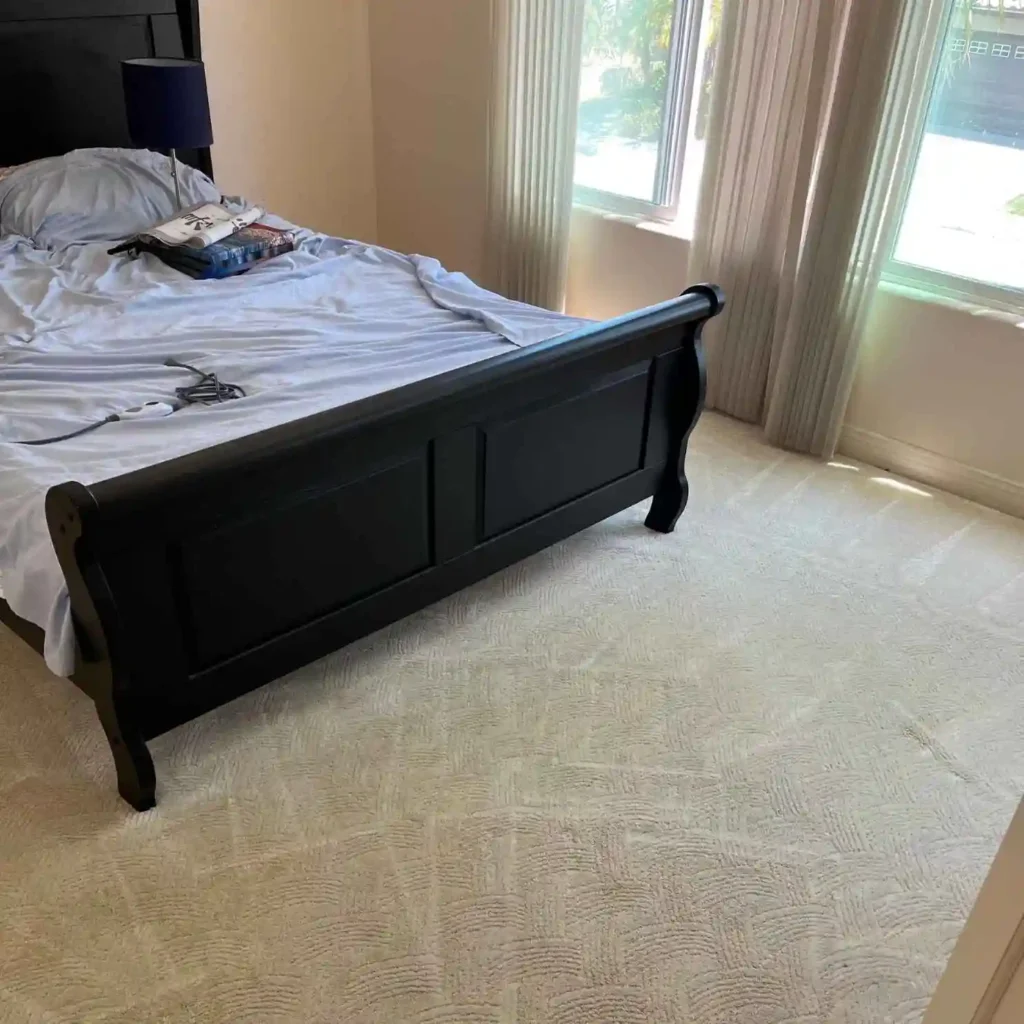 bright bedroom with freshly cleaned carpet.
