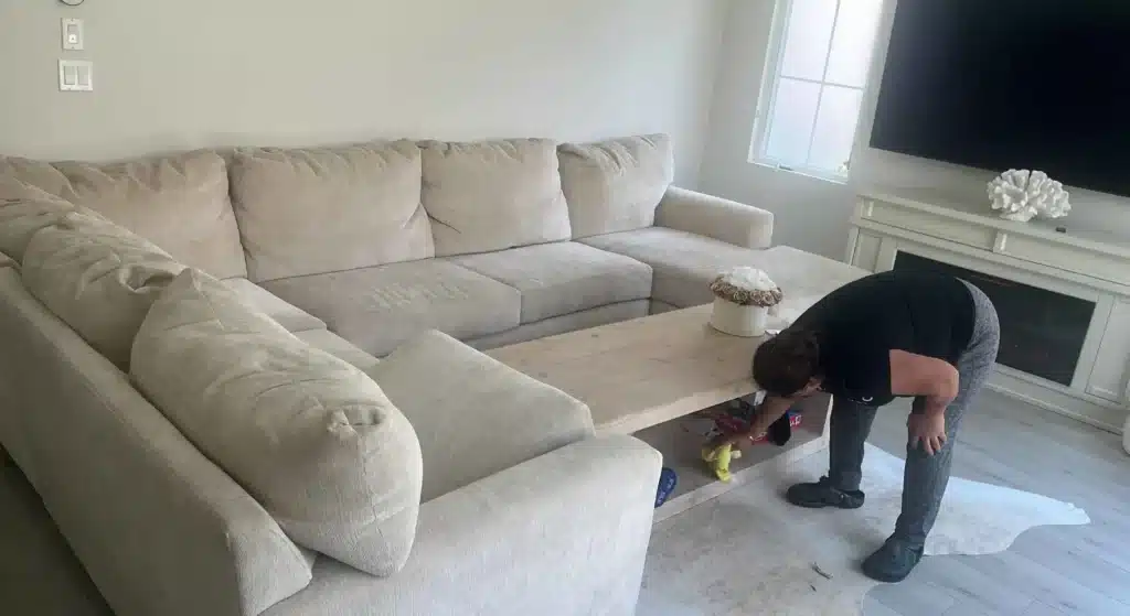 technician inspecting upholstery fabric before professional treatment.